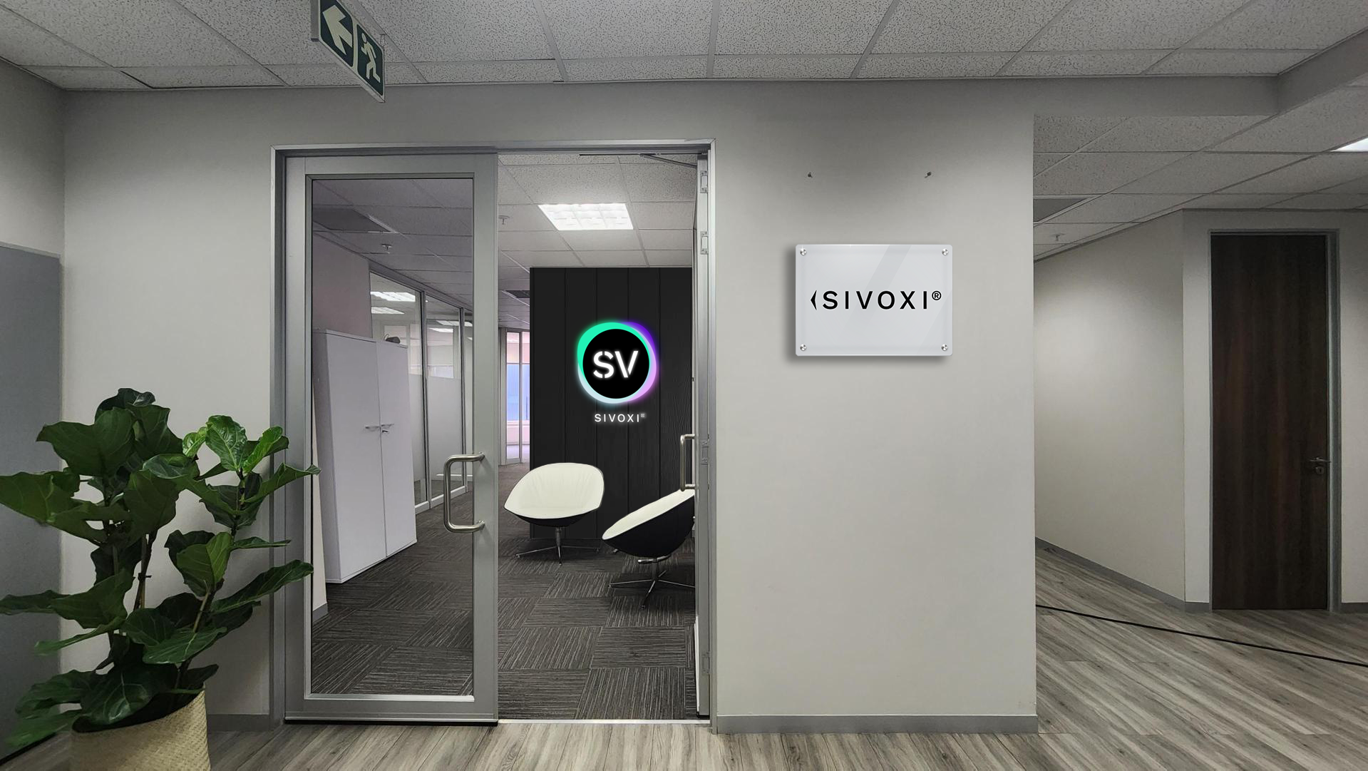 The SIVOXI office entrance with the SV logo on the wall